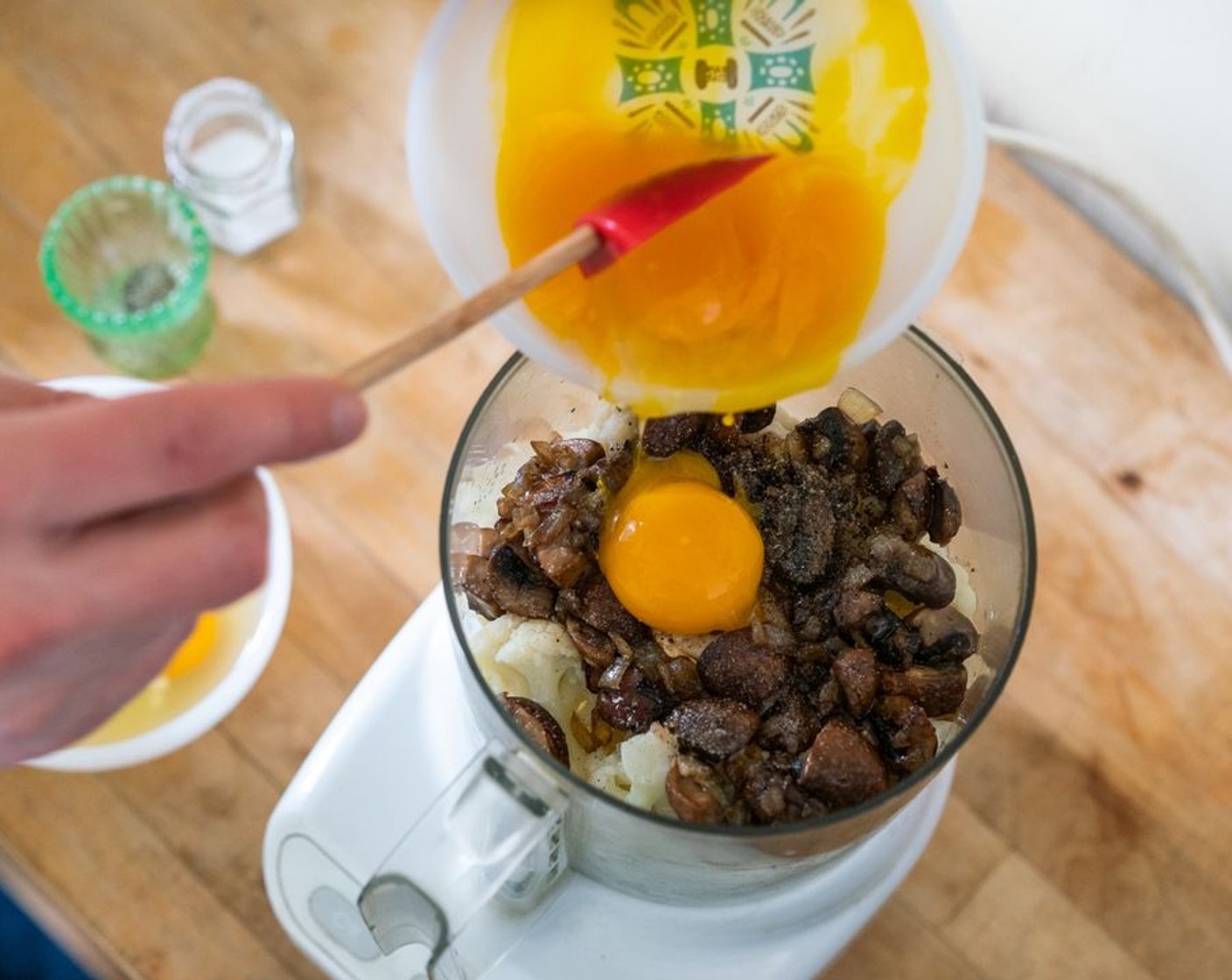 step 7 Transfer the mushrooms and onion (and any extra oil from the pan) to the food processor with the cauliflower. Add 3 large egg yolks and 4 Farmhouse Eggs® Large Brown Eggs (7). Process until the mixture has a smooth consistency with minimal clumps.