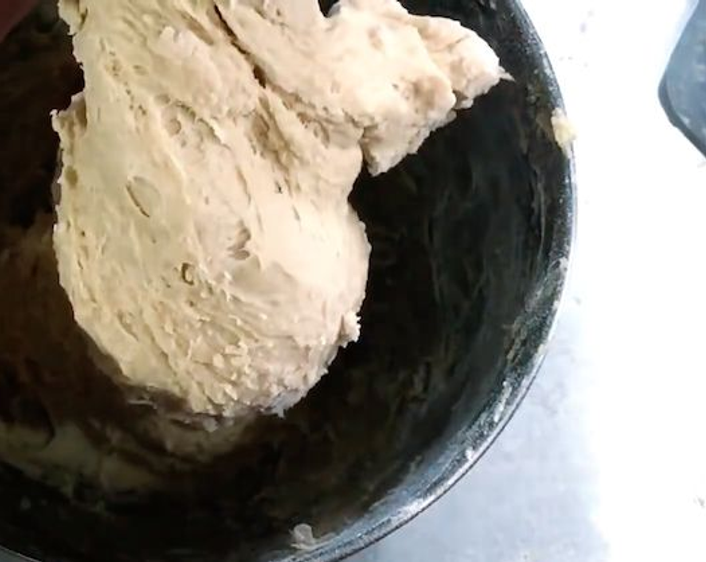 step 4 Switch to a dough hook and add All-Purpose Flour (1 cup). Mix until combined and scrape down the sides.