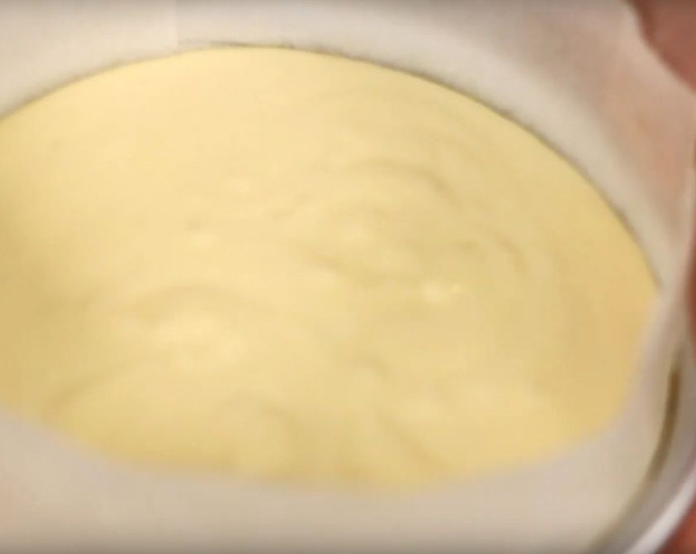 step 7 Transfer into a 6-inch cake pan with a removable bottom that has been greased and lined with parchment paper.