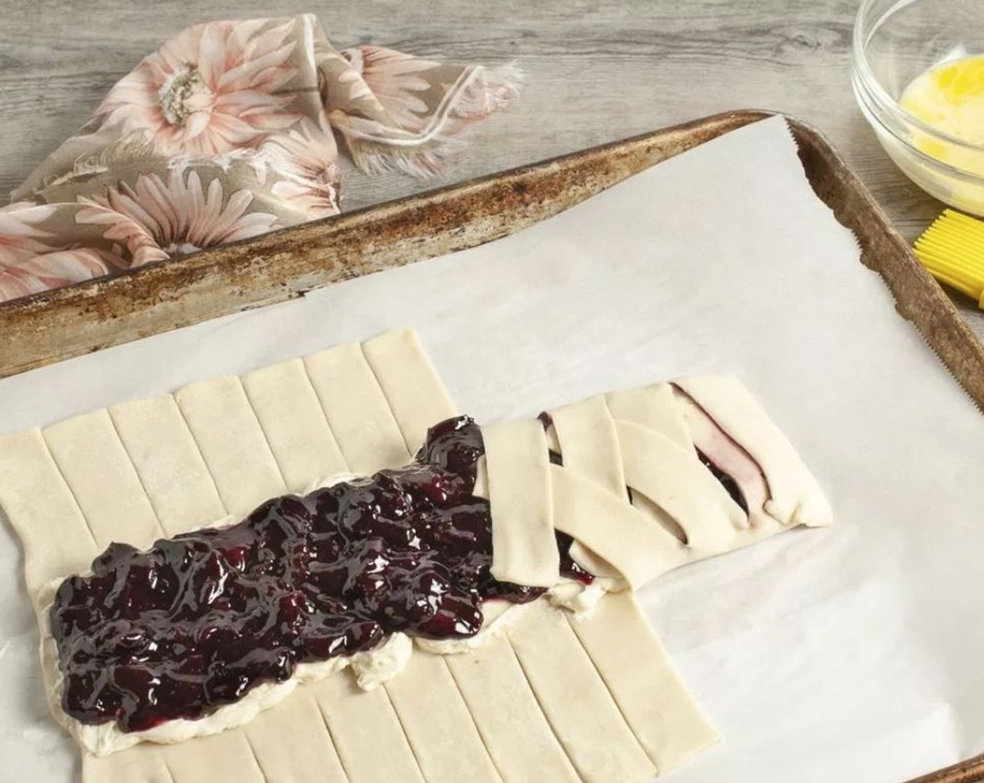 step 9 Spread cherry filling evenly on top of the cream cheese filling, leaving the fingers uncovered. Pull fingers across filling, alternating sides as you go. It's ok to have some small spaces in the pastry. Tuck any excess pastry underneath.