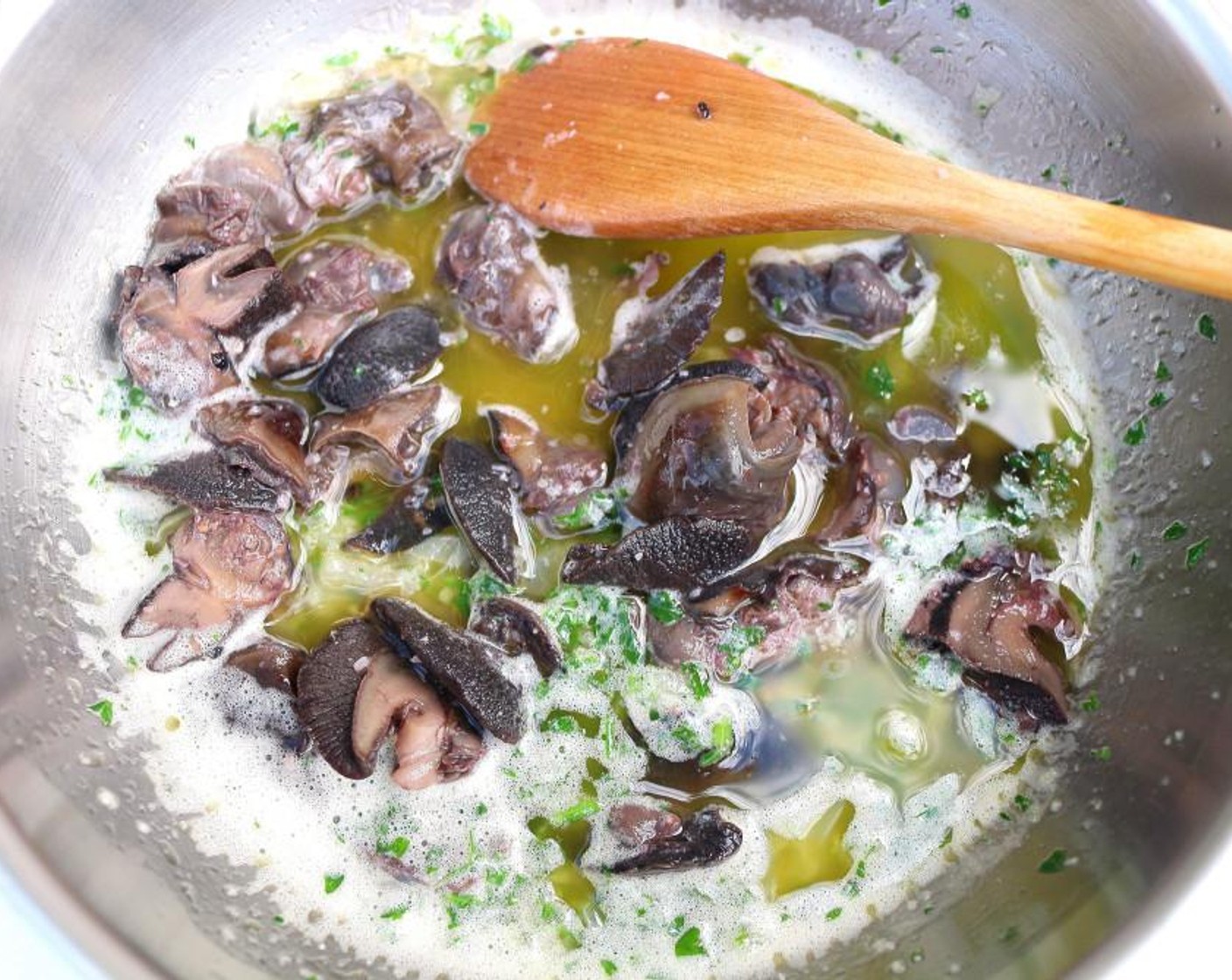 step 5 When the onions are translucent, add the snails and Fresh Parsley (2 Tbsp). Saute for 1 minute, adjusting seasoning as necessary.