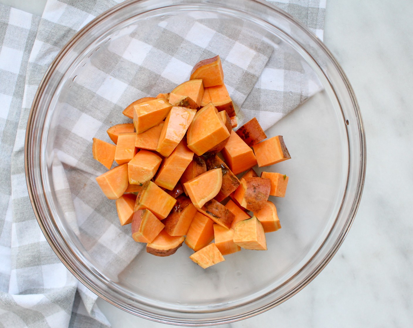 step 2 In a large bowl toss Sweet Potatoes (4) with Olive Oil (1/2 Tbsp), Dried Oregano (1/2 tsp), Salt (to taste), and Ground Black Pepper (to taste). Place on a large parchment paper-lined baking sheet. Bake for 20 minutes until sweet potatoes begin to soften.