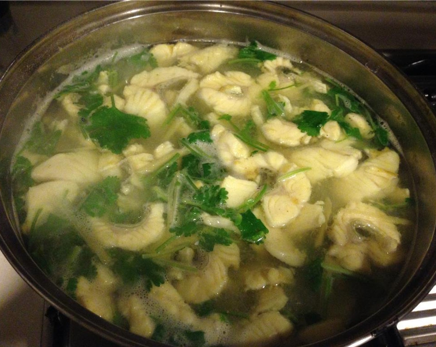 step 8 Once the water is boiling, add the marinated fish. Let cook for 5 minutes, then add the chopped cilantro. You can add more cilantro if you wish. Taste and adjust Ground White Pepper (1/4 tsp).