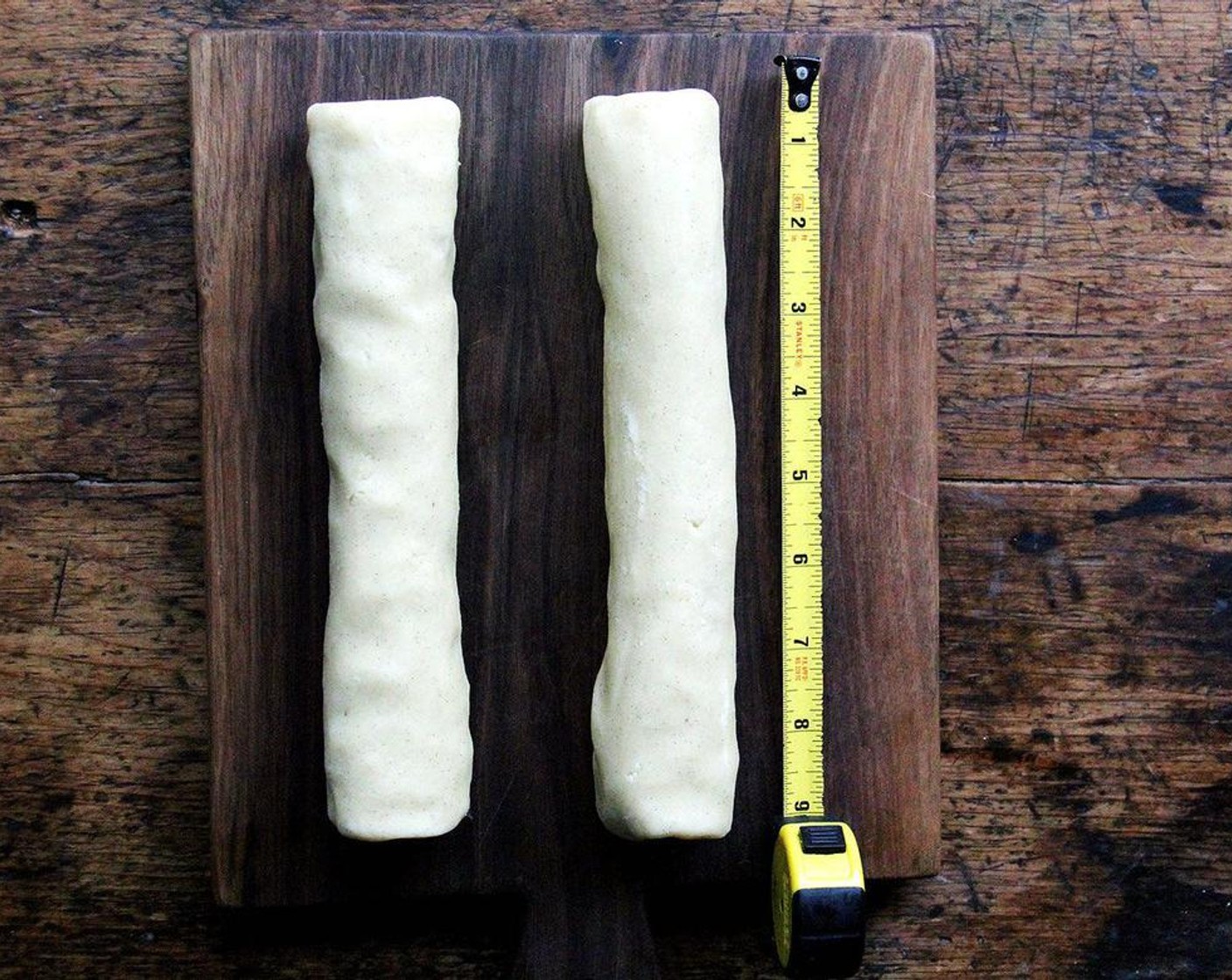 step 4 Turn the dough out onto a work surface and divide it in half. Shape each half into a log about nine inches long. Wrap the logs in parchment or plastic film and refrigerate for at least three hours.