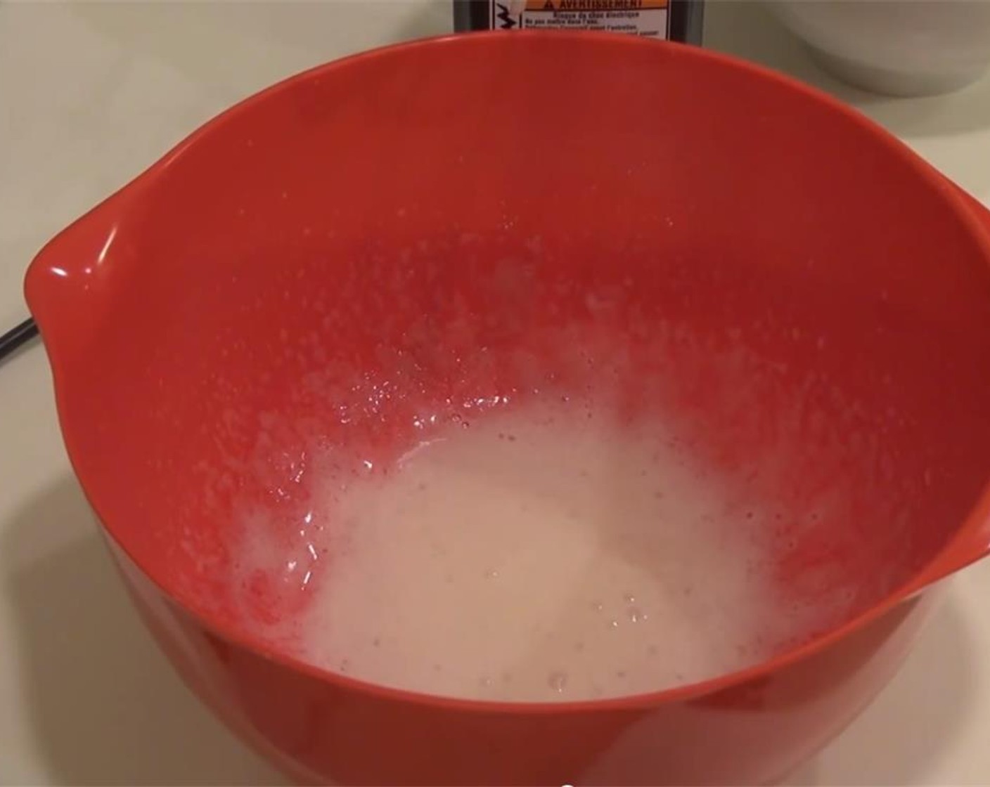 step 9 For the icing, place the Eggland's Best Classic Eggs (2) into a bowl, and add the Lemon Juice (to taste) and Salt (1 pinch). Whisk together with a mixer to loosen the egg whites. Start beating them until they are frothy.