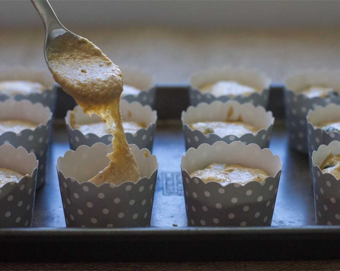 step 7 Promptly spoon the mixture into the muffin liners about 2/3 the way full. Sprinkle the crumb topping on each muffin and bake for about 25-30 minutes until a toothpick comes out clean. The tops will turn golden brown.