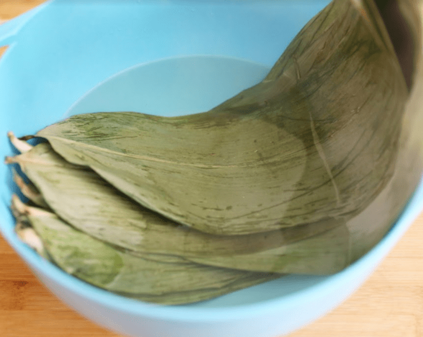 step 6 Soak the palm leaves in boiling water to until soft.