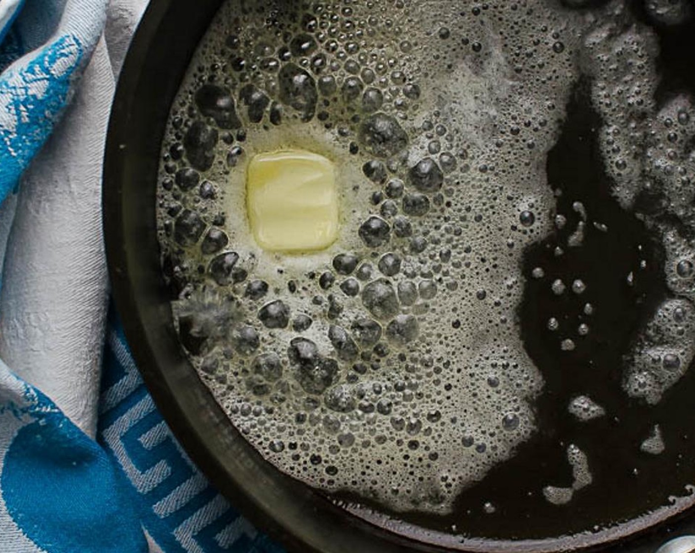 step 7 In an ovenproof heavy skillet or cast iron pan, melt the Butter (1 Tbsp) over medium high heat.