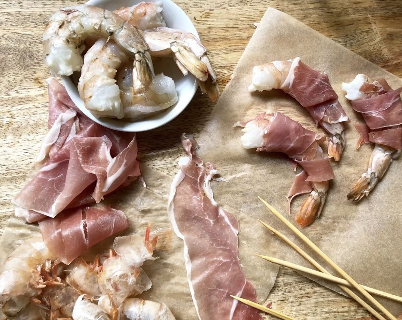 step 3 Wrap each cleaned Jumbo Shrimp (8) with a slice of Prosciutto (8 slices). Thread 2 wrapped shrimp on metal skewers or wooden skewers that have been soaked in water for about 10 minutes. Repeat with remaining shrimp.