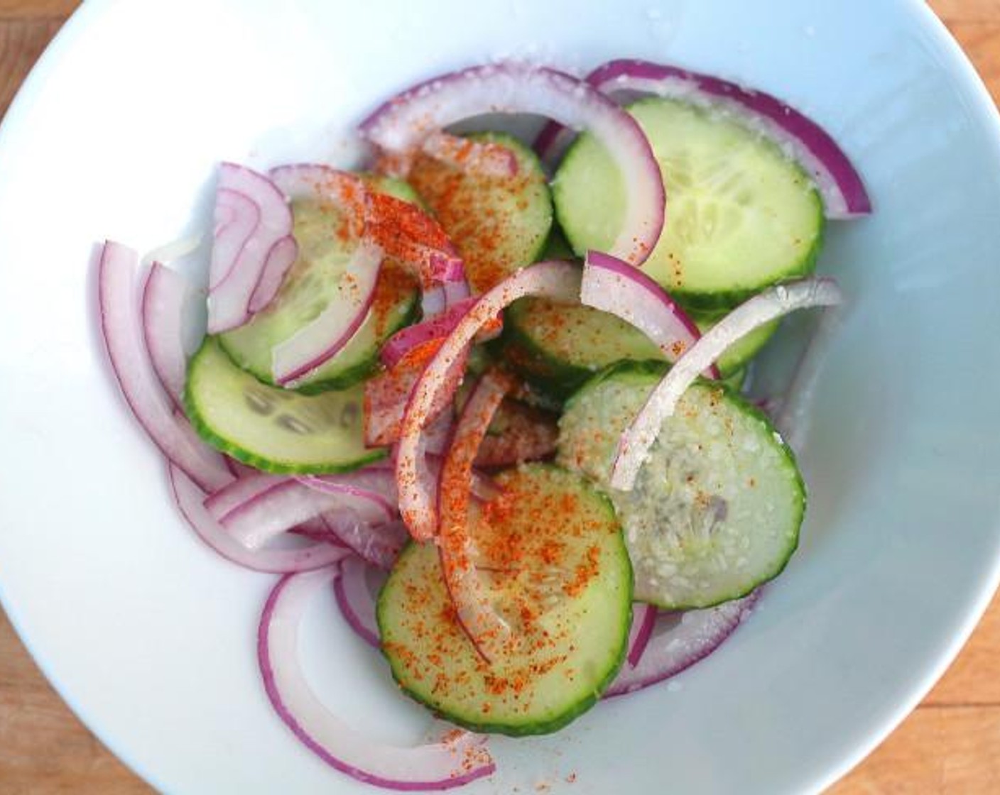 step 3 Marinate Red Onion (1/4) and Cucumber (1/2) in Apple Cider Vinegar (1 Tbsp) and Kosher Salt (to taste) and Cayenne Pepper (to taste).