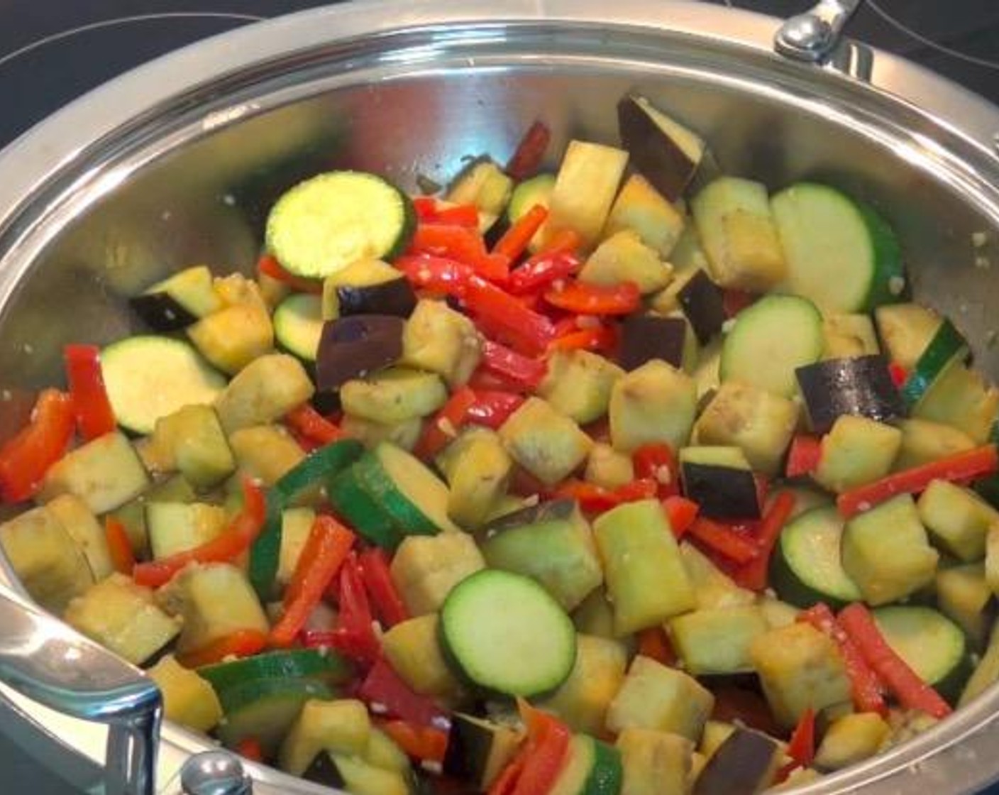 step 2 Add Eggplant (1) and Zucchini (2). Stir together and cook for another 2 minutes, or until the vegetables begin to soften.