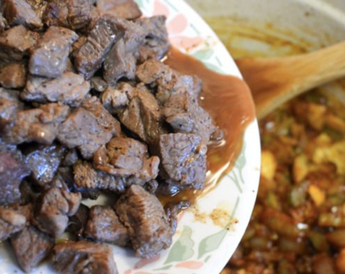 step 9 Give everything a good stir then add the beef back into the pot along with all those juices. Pour in the Guinness® Stout Beer (1 1/2 cups) and Beef Broth (2 cups) and bring the stew to a boil.