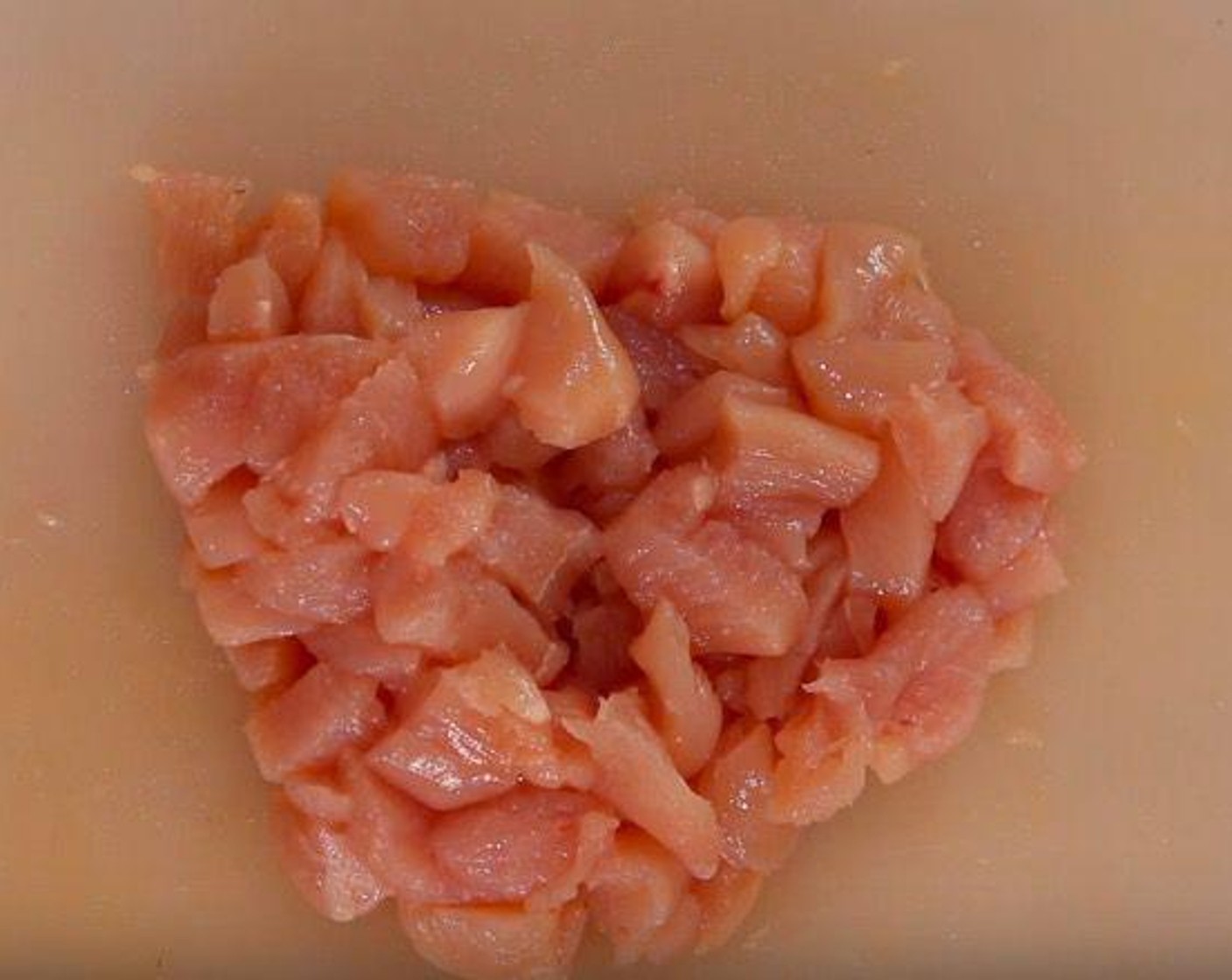 step 1 Cut Chicken Breast (1) into 1-centimeter pieces, about the size of a piece of popcorn. Transfer to a bowl.