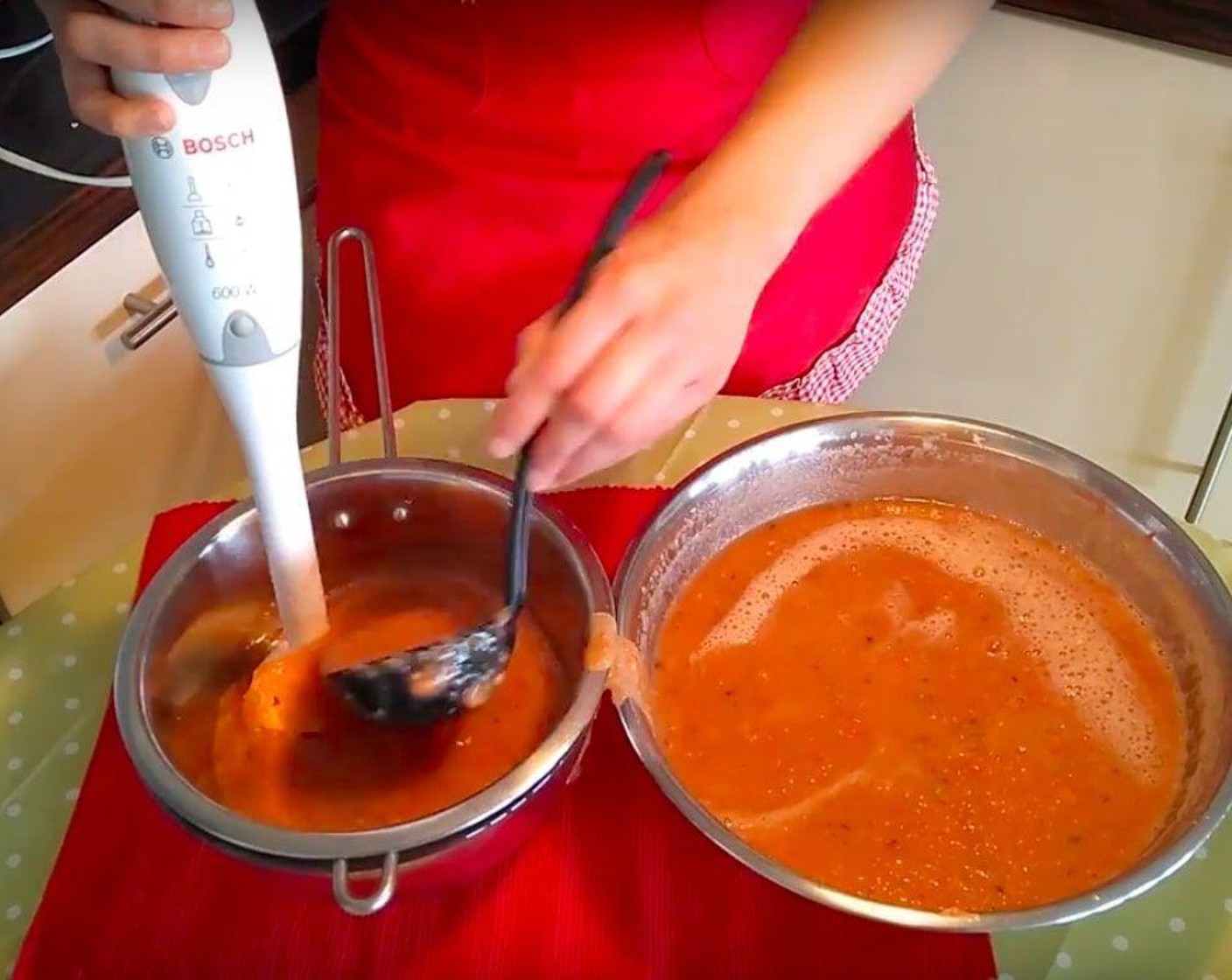 step 6 Strain through a colander to smooth out the gazpacho, blending as you go.
