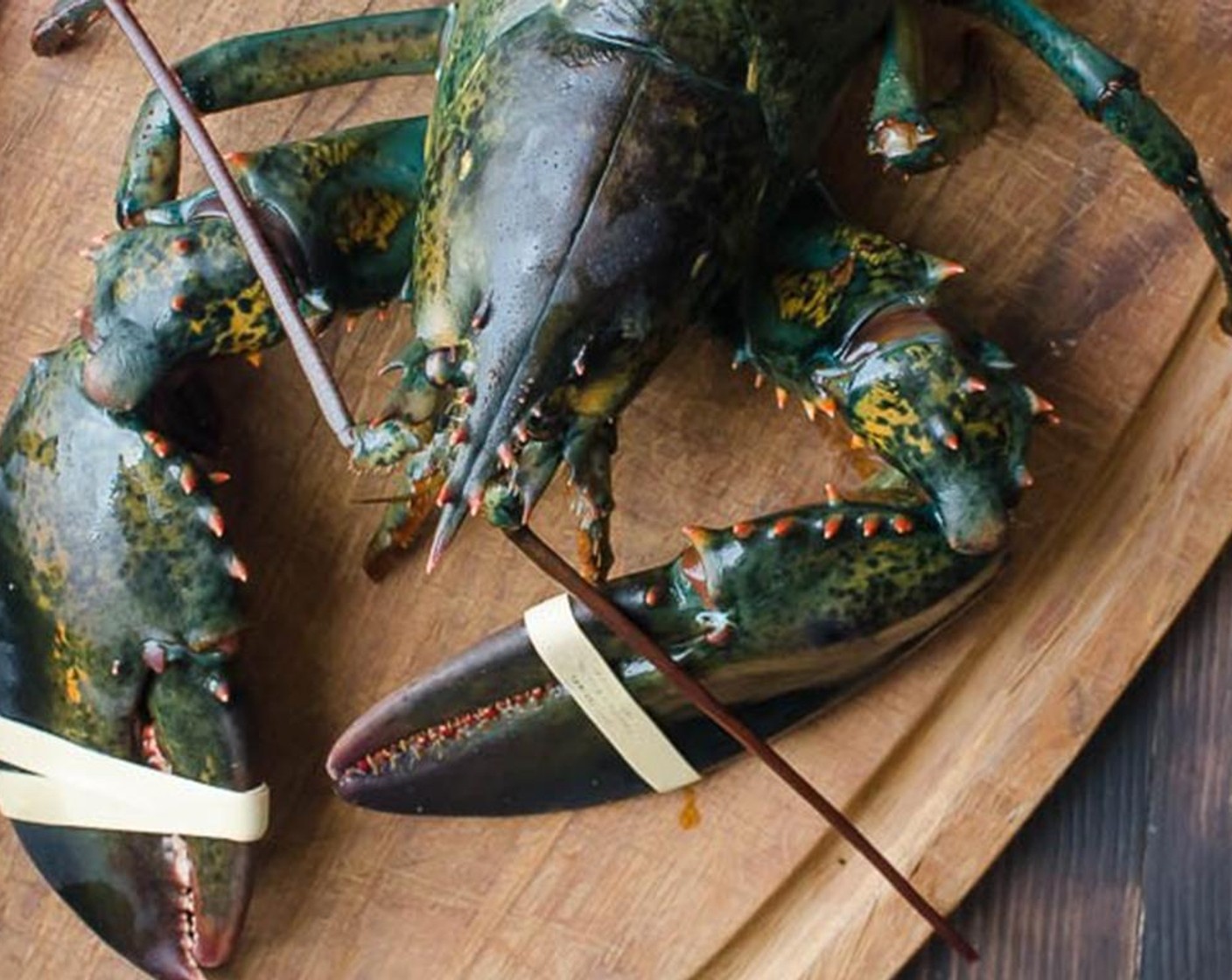 step 1 If you're working with live lobsters, use a large pot with a steamer to cook the lobsters in. A 1 1/4 lb lobster should take about 14-16 minutes to cook. Add 1 inch of water and Kosher Salt (1 Tbsp) to the bottom of the pot. Bring to a boil.