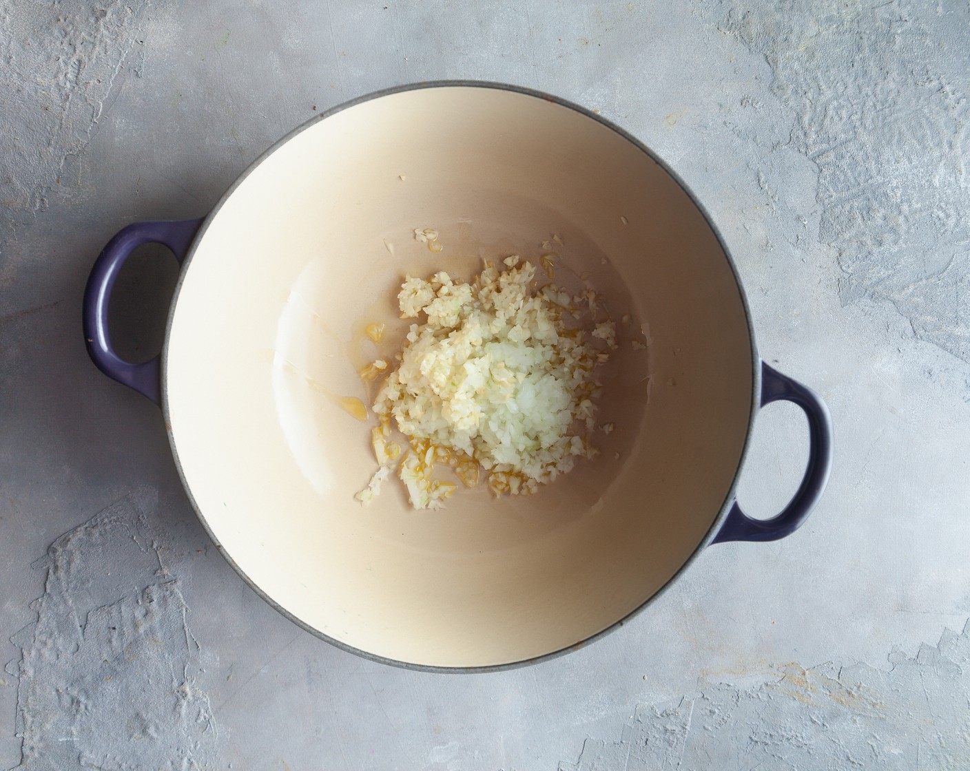 step 1 Heat the Olive Oil (2 Tbsp) in a large soup pot over medium-high heat. When the oil is shimmering, add the Onion (1) and Garlic (4 cloves) and sauté until translucent.