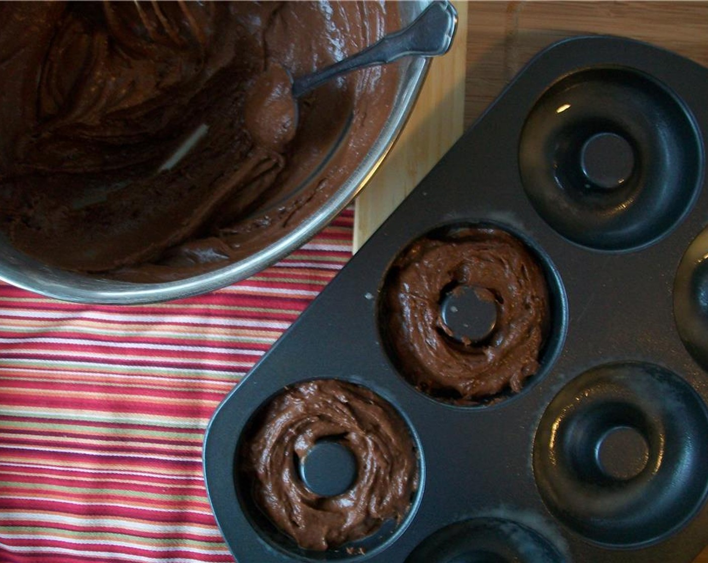 step 6 Grease donut pan and fill 2/3 full, and bake for 13 minutes.