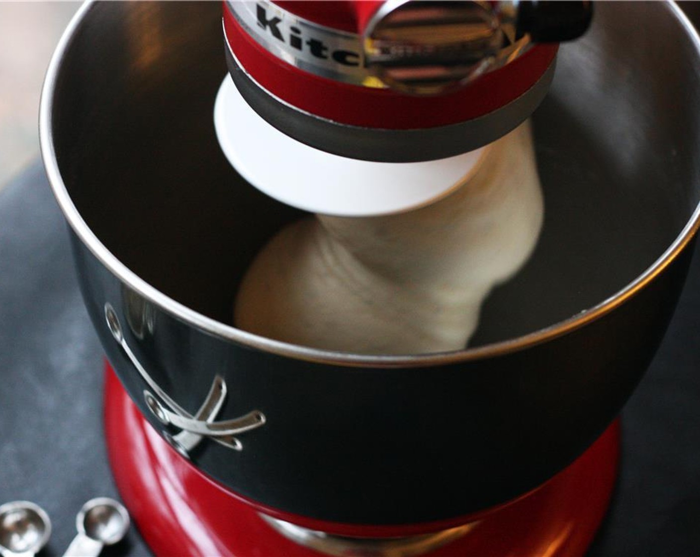 step 3 Place the dough hook on the mixer and knead on low speed for 6-8 minutes until a smooth ball of dough is formed. You can also knead by hand on a floured surface for 8-10 minutes.