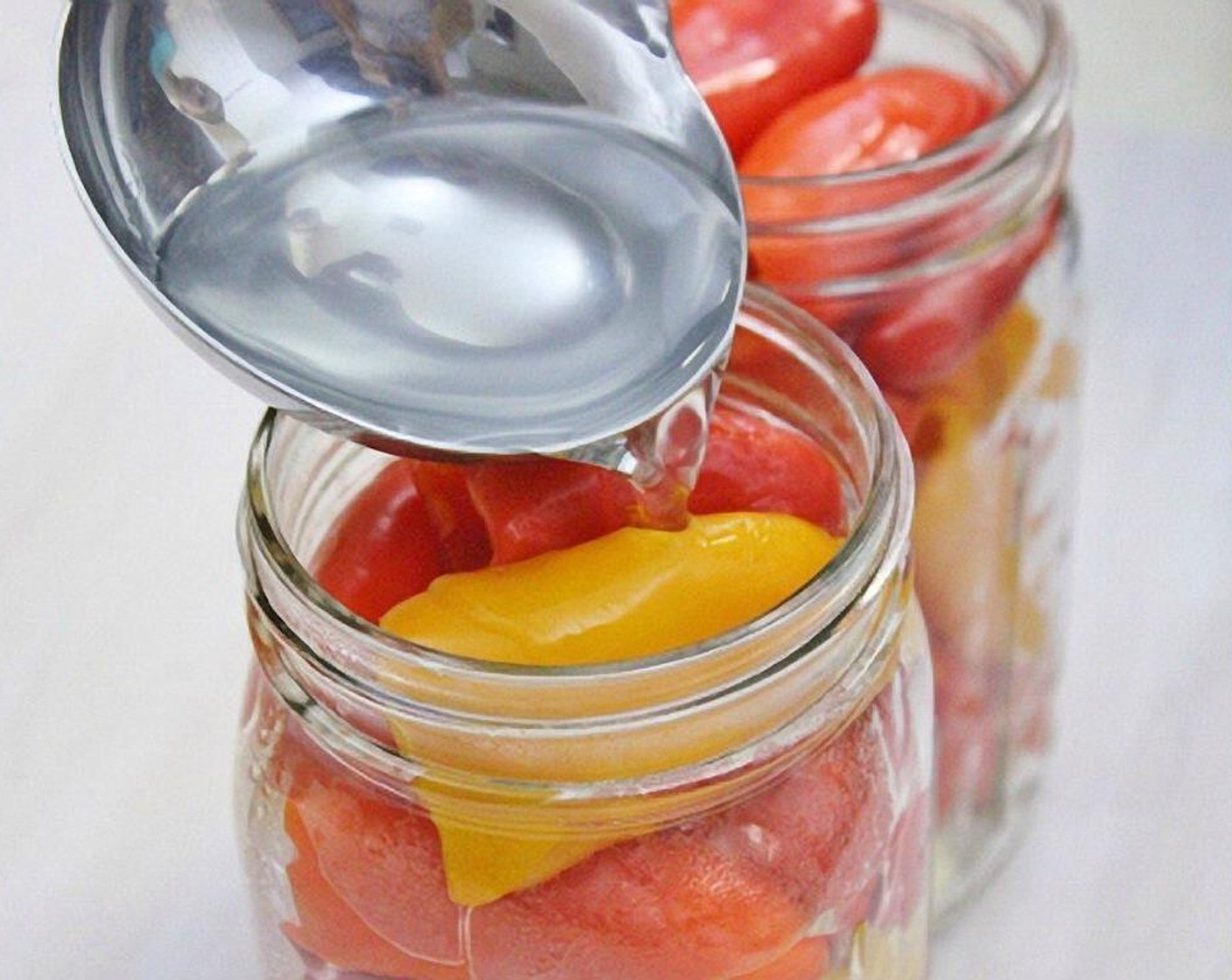 step 6 Pour the marinade over the peppers. Seal each jar. (If you want to store them for a longer time, sterilize the jars and lids in boiling water and put the filled jars into a water bath for 15 minutes.)