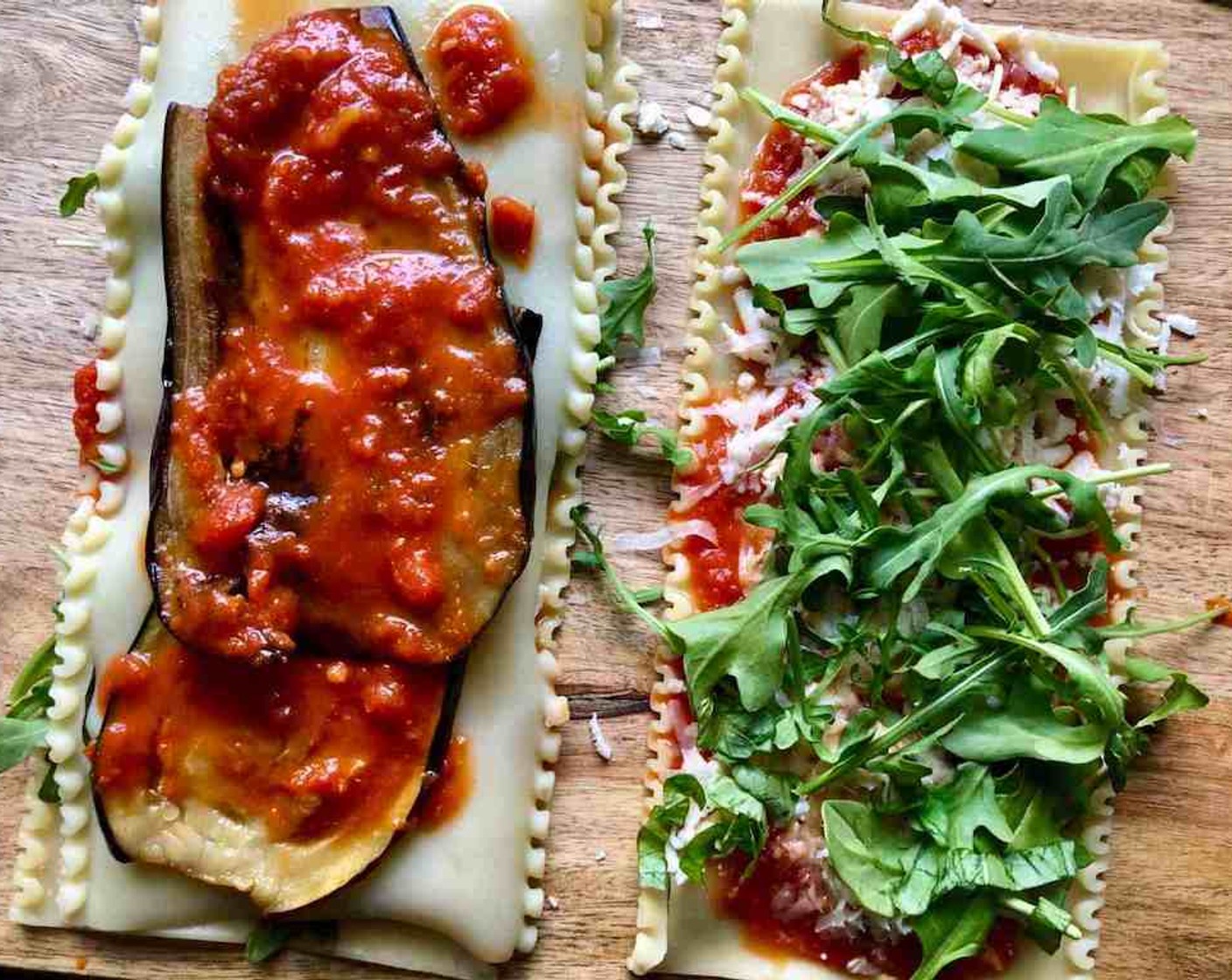 step 9 Top that off with another lasagna noodle, then 2 eggplant slices to cover the length of the entire noodle. Top the eggplant with 2 heaping tablespoons of tomato sauce. Starting with a short end, roll up the stack into a spiral.