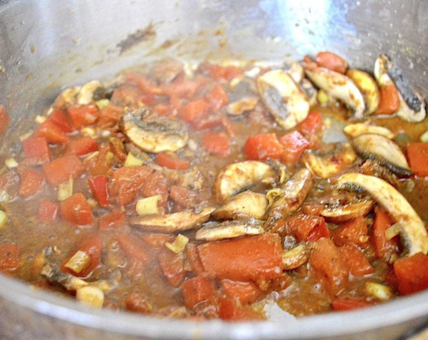 step 4 Let them soften and get fragrant for a few minutes, then stir in the remaining Curry Powder (1 Tbsp), Salt (1 pinch), Garam Masala (1 Tbsp), and Chili Paste (1 Tbsp). Let that cook together for another minute before you pour in the Coconut Milk (1 can) and Chicken Stock (1 cup).