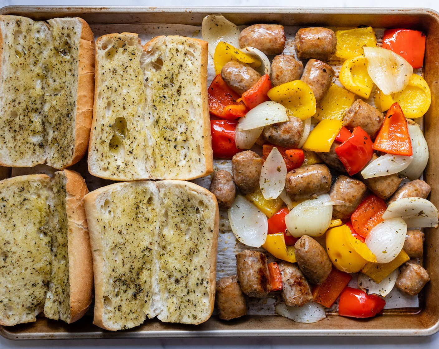 step 6 Use a spatula to move the veggies and meat to one side of the sheet pan. Place the buns, cut side up, and open, facing up. Return to the oven for 3-4 minutes to gently toast the buns.