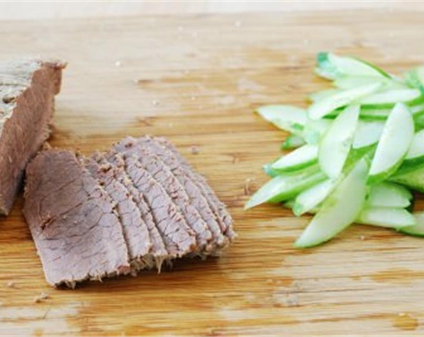 step 7 Cut the Korean Cucumber (1/2) in half lengthwise. Thinly slice crosswise, lightly sprinkle with salt, and let it sit until the cucumber slices are wilted.