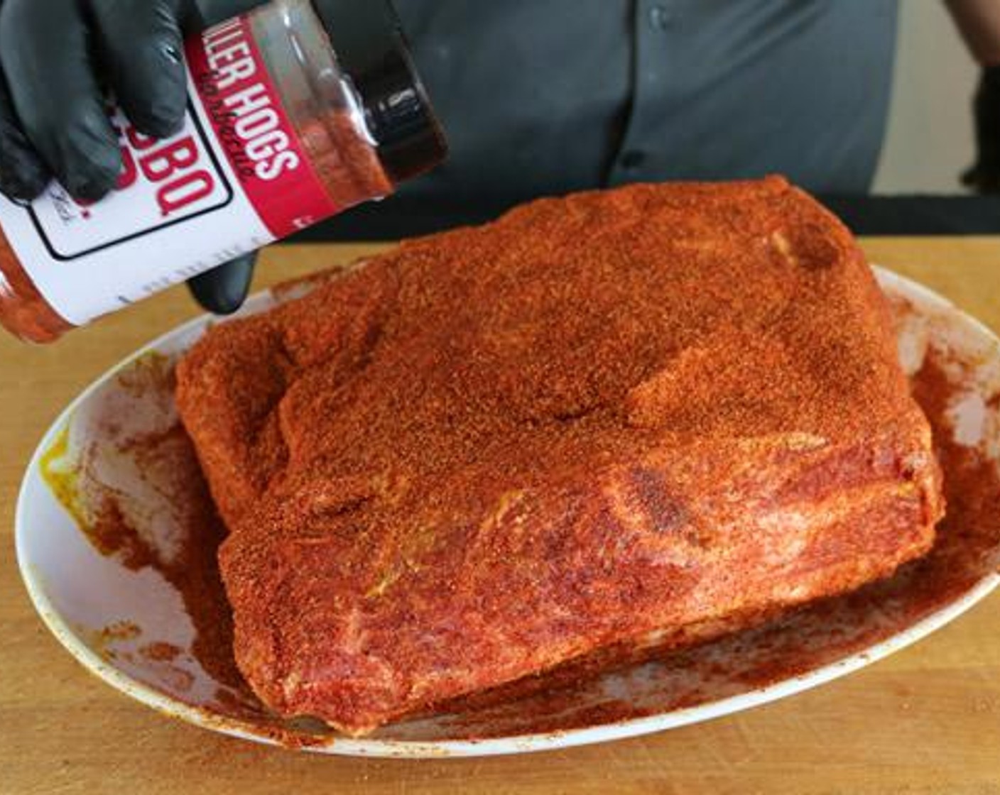 step 1 Pat dry the Boneless Pork Shoulder (8 lb). Coat with Yellow Mustard (3 1/2 Tbsp) and Barbecue Rub (1 cup).