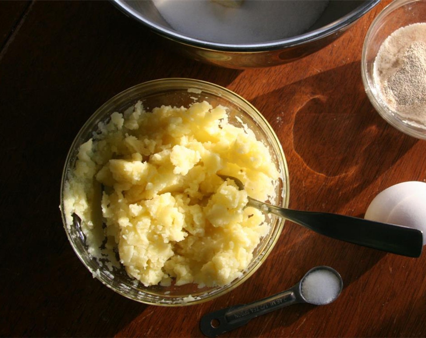 step 2 Drain and reserve the liquid, and let the liquid cool to 95-110 degrees F (35-45 degrees C) until lukewarm. While you are waiting, mash the potato and set aside.