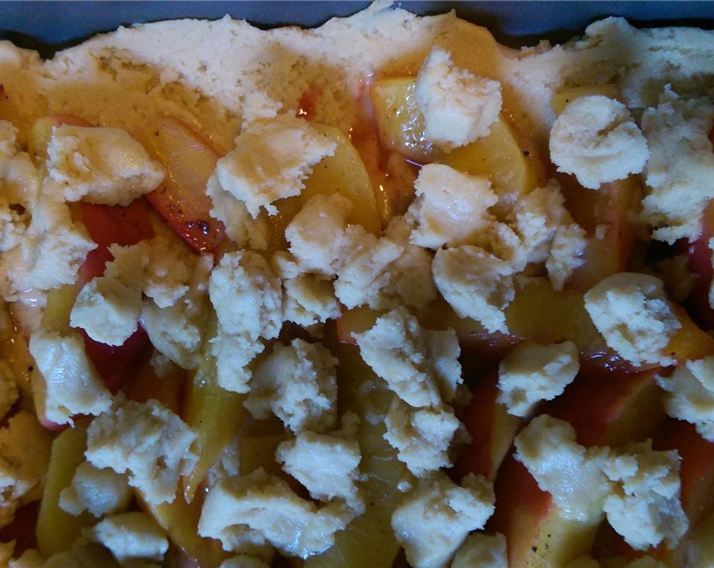 step 6 Arrange peach slices over top and dot remaining dough over the top of the peaches.