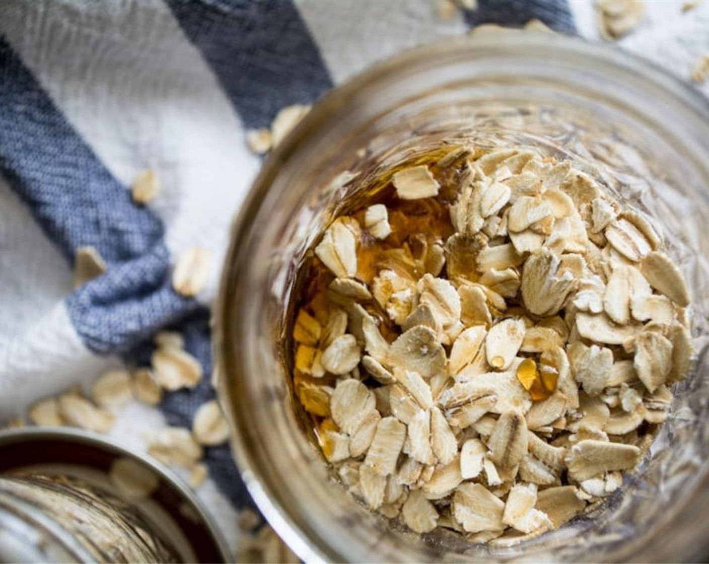 step 1 With an 8 ounce mason jar, begin by adding Oats (1/2 cup).