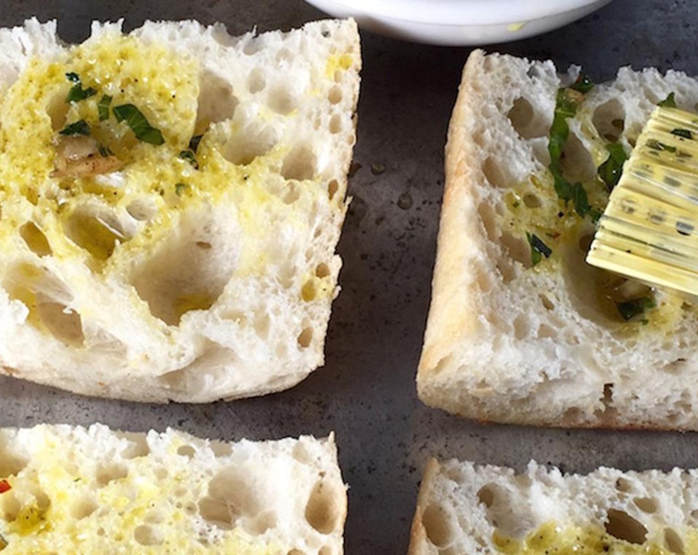 step 3 Cut the Ciabatta Bread (1 loaf) into fours and brush with the garlic oil.