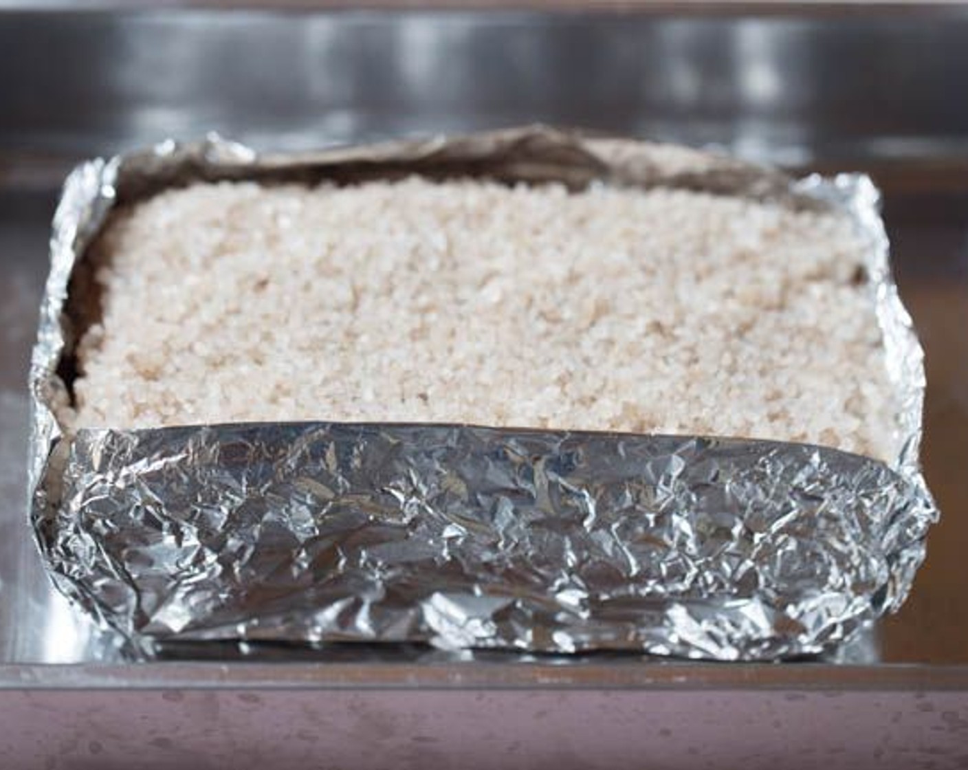 step 9 Brush a thin layer of Distilled White Vinegar (to taste) and spread Sea Salt (to taste) evenly to form a protecting layer on the pork. Roast for 50 minutes to 1 hour.