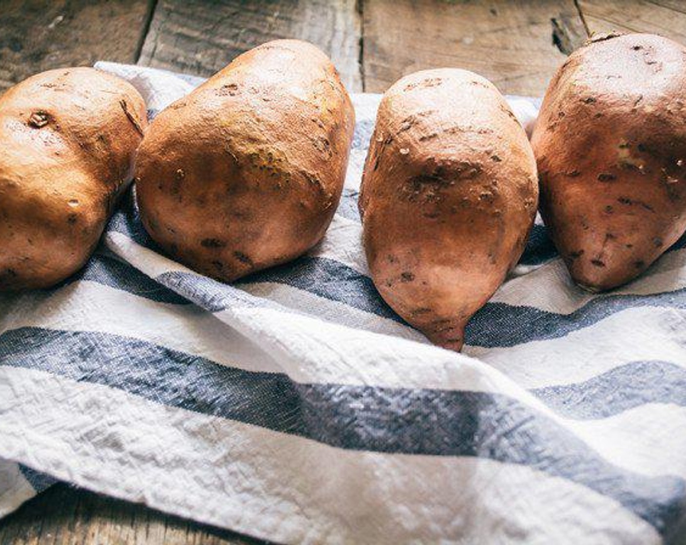 step 2 Scrub Sweet Potatoes (4) and prick each one several times with a fork. Add to baking pan and line with aluminum foil to avoid cleanup and bake 50-60 minutes or until cooked through.