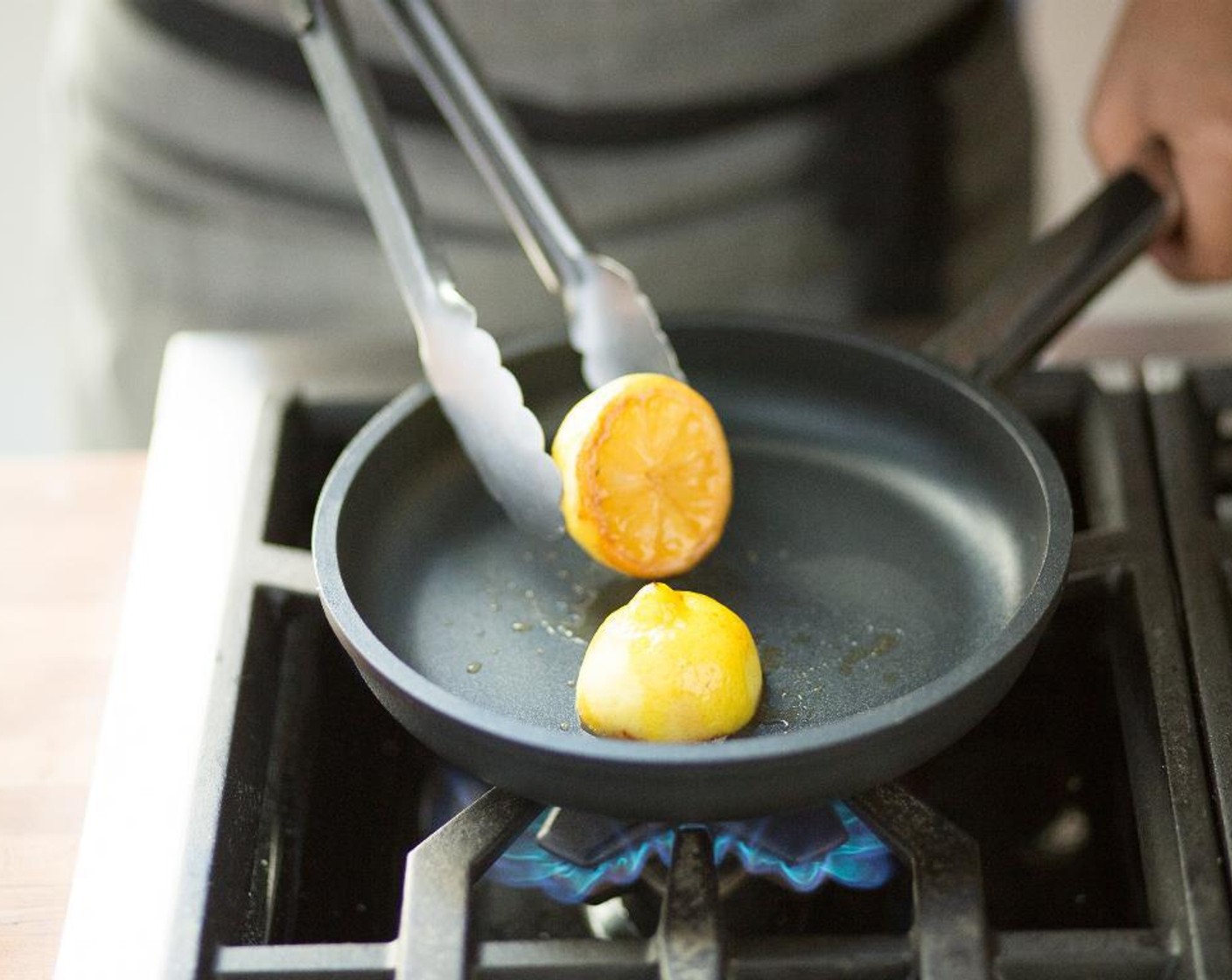 step 6 Turn the heat back on and sear for another 3 to 4 minutes until charred. Remove from heat. When cool, squeeze the juice out into another small bowl and hold.