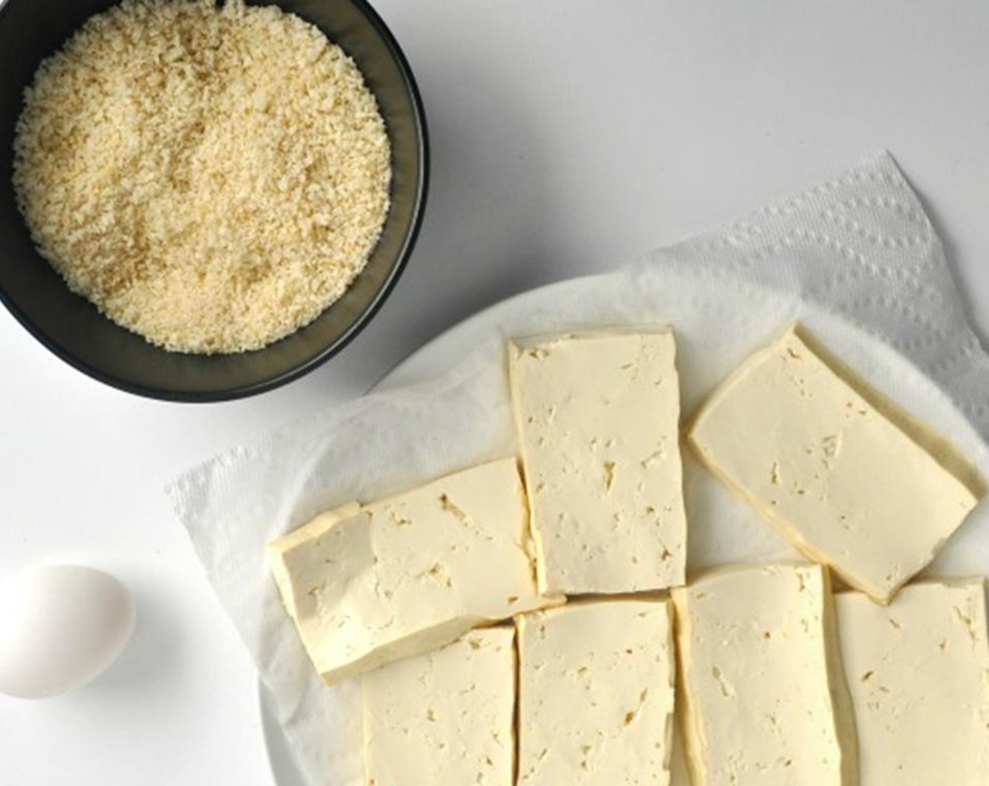 step 2 Pat Firm Tofu (7 oz) dry with paper towels and cut into 1/2 inch slices.
