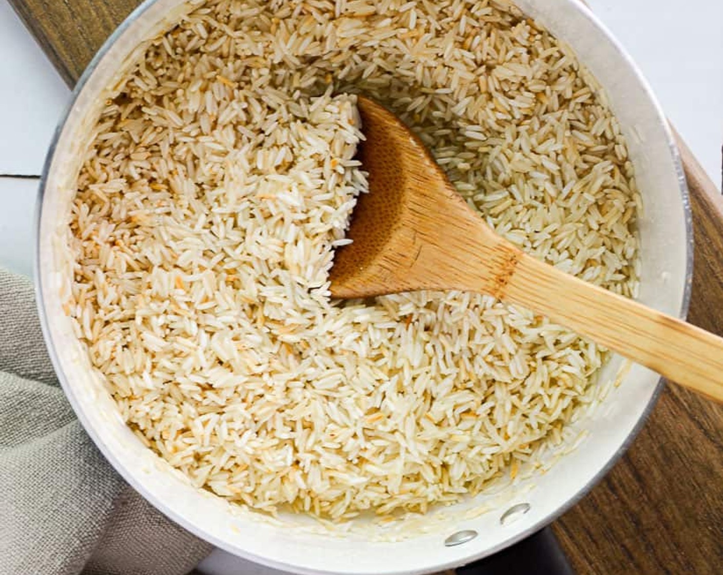 step 1 Pour the Avocado Oil (2 tsp) into a medium pot and add the Long Grain White Rice (1 cup). Stir to coat evenly and turn on stove heat to medium. Toast until white rice is a light yellow almost brown shade – about 5 minutes. Make sure to stir often to avoid burning.