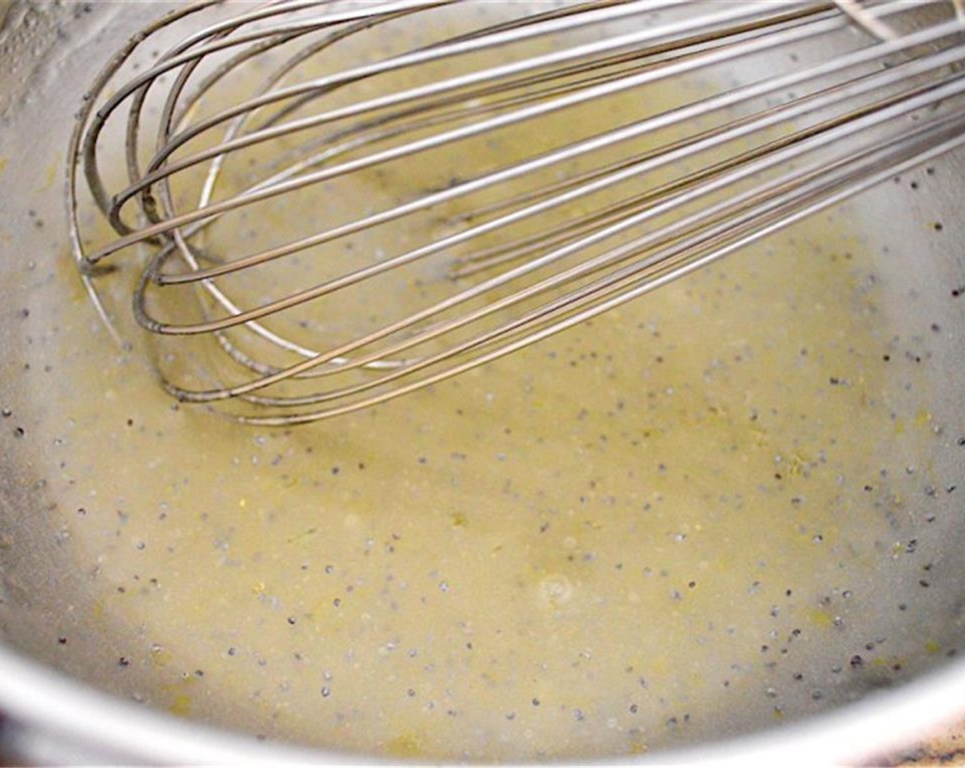 step 2 Then whisk the zest and juice of the Lemon (1), Granulated Sugar (1/3 cup), Dry Mustard (1/4 tsp), and Salt (1/4 tsp) together in another bowl. While you keep whisking, slowly pour in the Canola Oil (1/2 cup) and continue to whisk until it is a thick dressing.