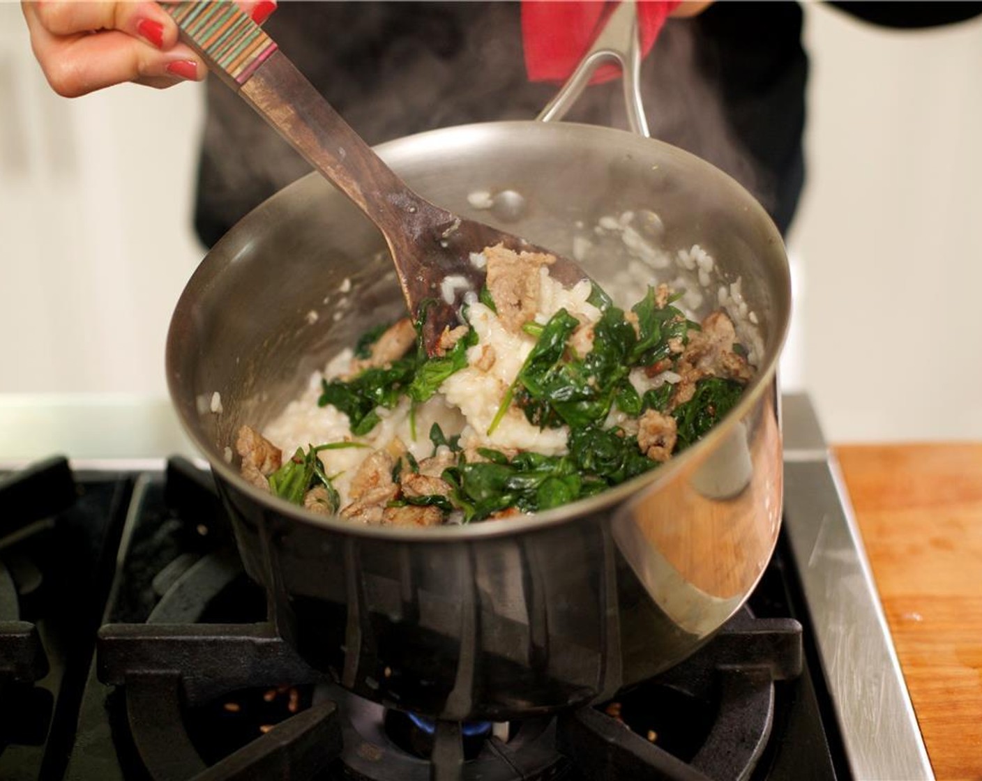 step 12 Finish risotto by adding the Unsalted Butter (2 Tbsp), Parmesan Cheese (1/2 cup), spinach sausage mixture, lemon juice, and Salt (1/4 tsp). Stir again.