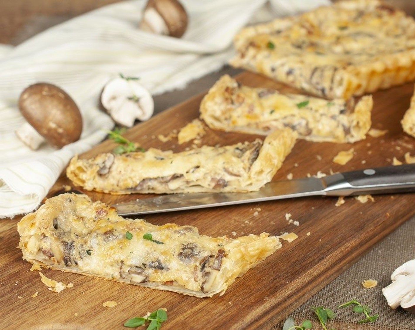 step 9 Allow tart to rest for a couple of minutes prior to removing the outer pan. Cut into wedges, garnish with more fresh thyme and serve.