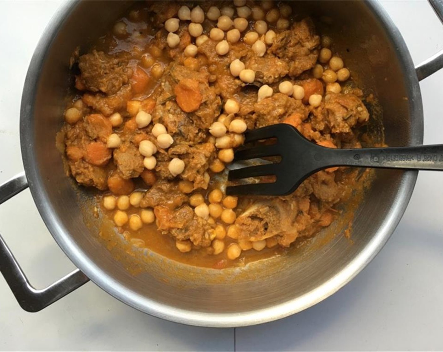 step 5 Stir well again. Bring the stew to a good boil and then turn the heat low. Put a lid on the casserole and let the lamb stew for 90 minutes. Then let the stew cool down fully.Then reheat the stew again and add the drained Canned Chickpeas (2 cups).