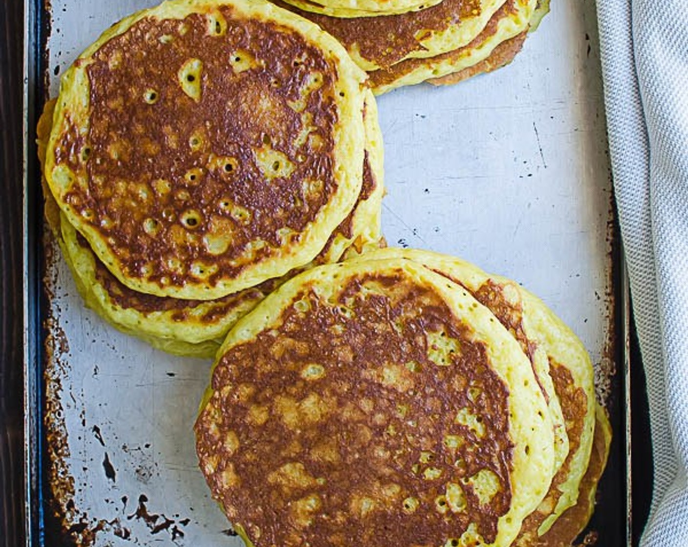 step 8 Transfer pancakes to an oven-safe platter and place the platter in the oven to keep them warm while you continue making the rest of the pancakes.