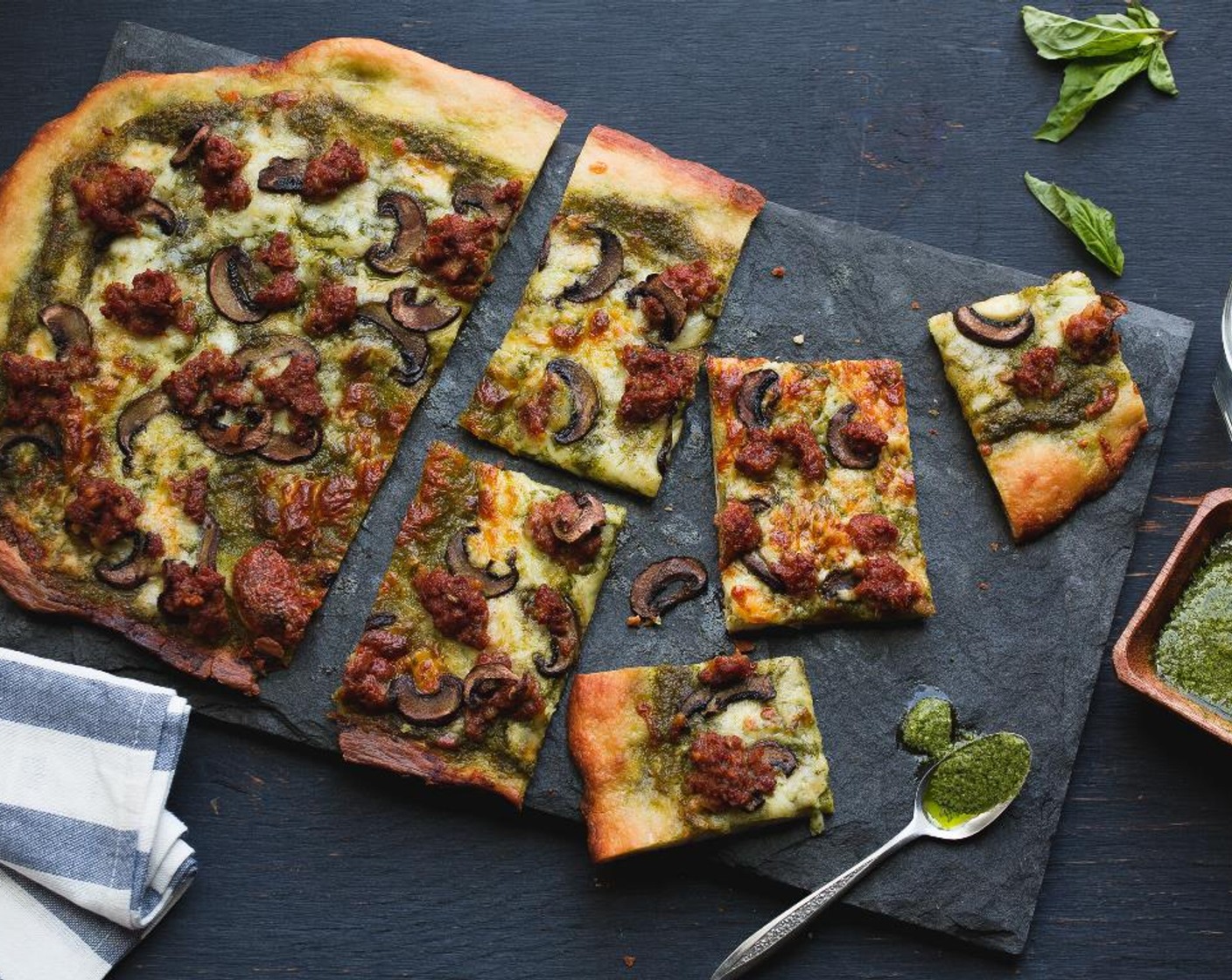step 10 Serve the slices of the Italian Sausage Pesto Pizza on two plates or family style! Serve and enjoy!