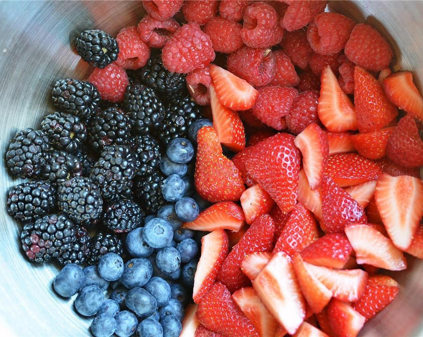 step 6 In a large mixing bowl, carefully toss together Fresh Blackberry (1 cup), Fresh Blueberry (1 cup), Fresh Raspberries (1 1/3 cups), Fresh Strawberries (2 cups), with Granulated Sugar (3 Tbsp), All-Purpose Flour (4 Tbsp), and Lemon (1).