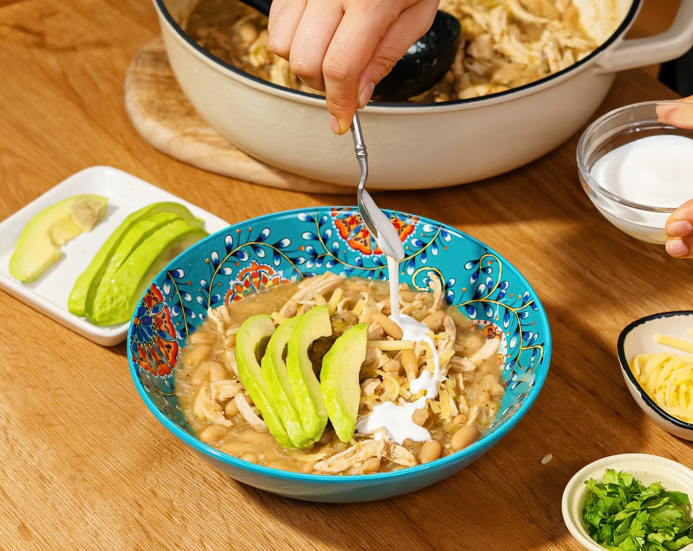 step 4 Serve with Tortilla Chips (to taste), Fresh Cilantro (to taste), Sour Cream (to taste), White Cheese (to taste), and Avocados (to taste) as desired.