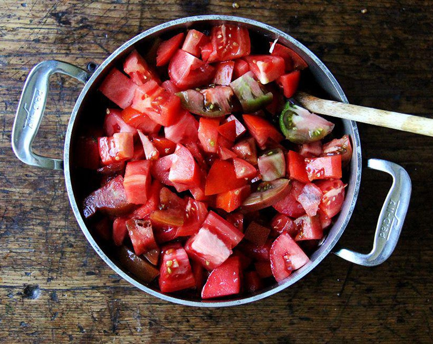 step 2 Add the Tomatoes (10 cups) and Kosher Salt (1 tsp) to the pot and bring to a simmer over medium-high heat, stirring every so often to ensure the onion isn't scorching on the bottom of the pan.