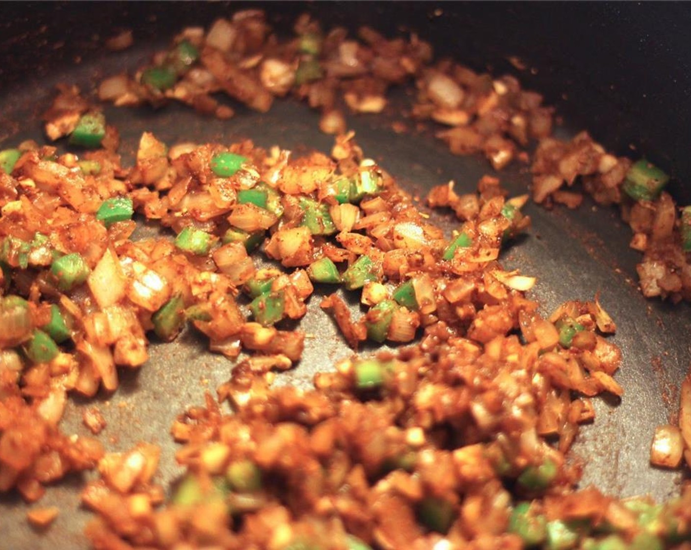 step 7 Then add the jalapeño pepper and garlic cloves, cooking with the spices for another minute.