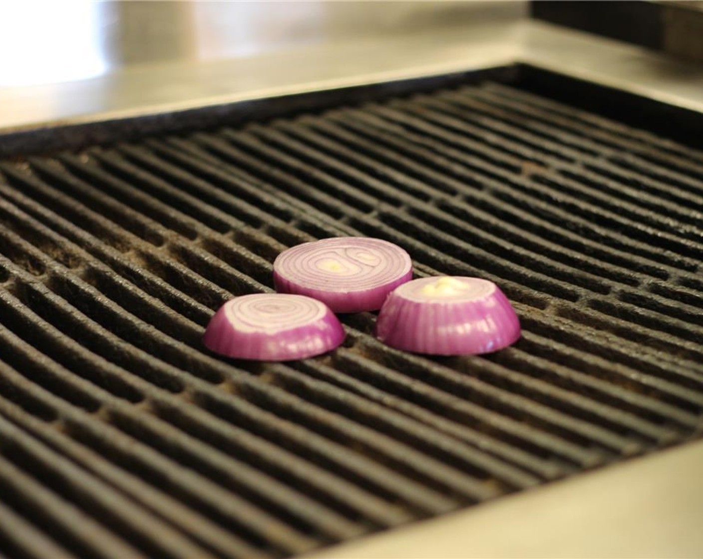 step 2 Grill the onions over high heat, about 1 minute per side.