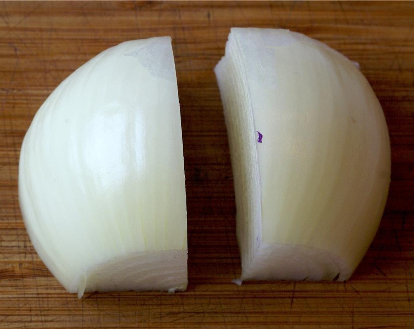 step 4 Peel Yellow Onion (1) and cut in quarters.