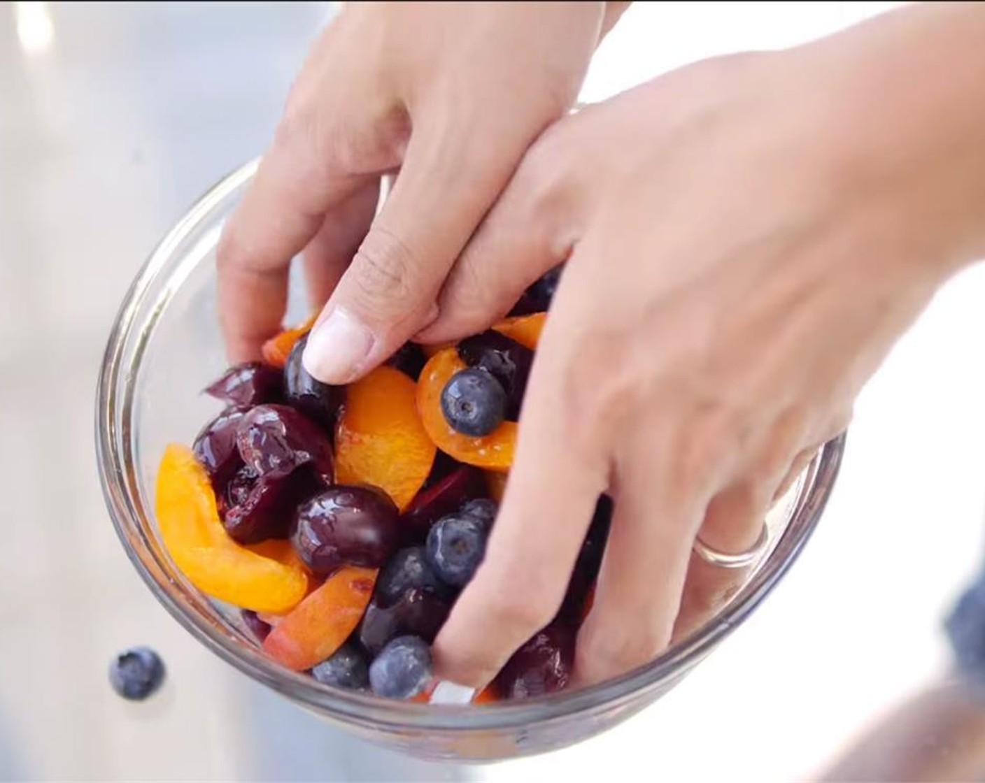 step 1 Pit and halve the Cherries (to taste). Peel, pit, and cut the Apricots (to taste). Add both to a bowl with the Fresh Blueberries (to taste) and sprinkle with Granulated Sugar (2 Tbsp). Add the juice of the Lemon (1/2) and Riesling (1 splash). Toss well.